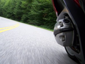 I love this photo.  The blur of the pavement adds to the look of going fast.